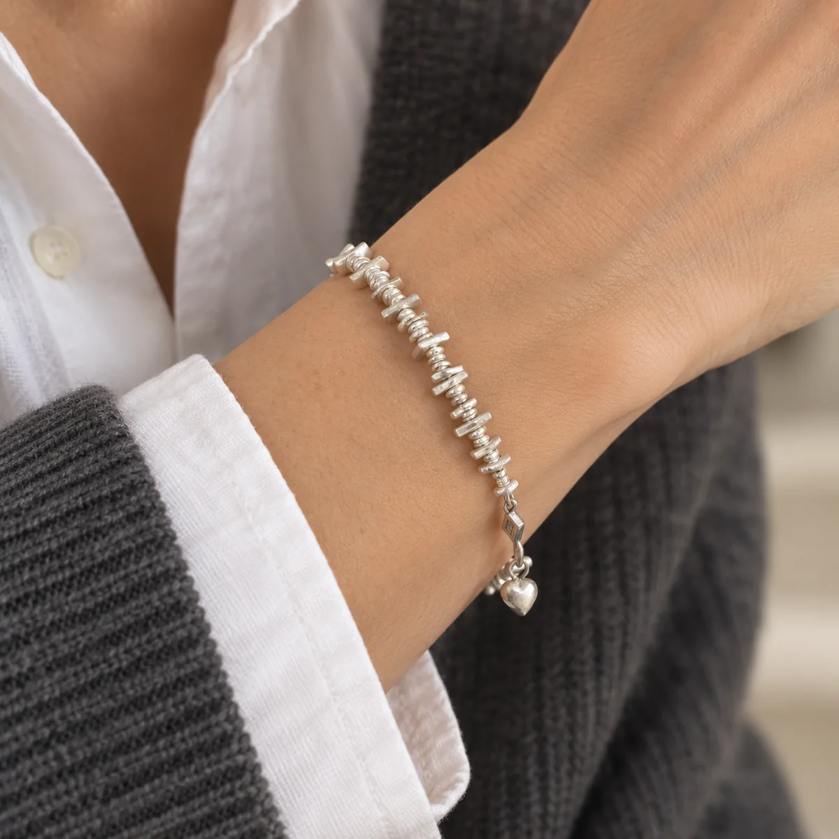 Geometric Silver Heart Bracelet worn or styled