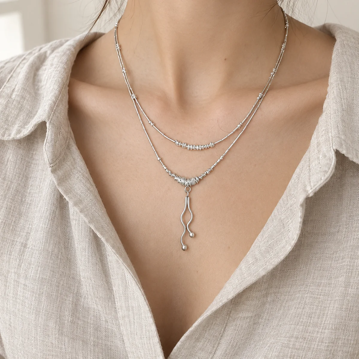 Wrapped Drop Silver Necklace worn or styled