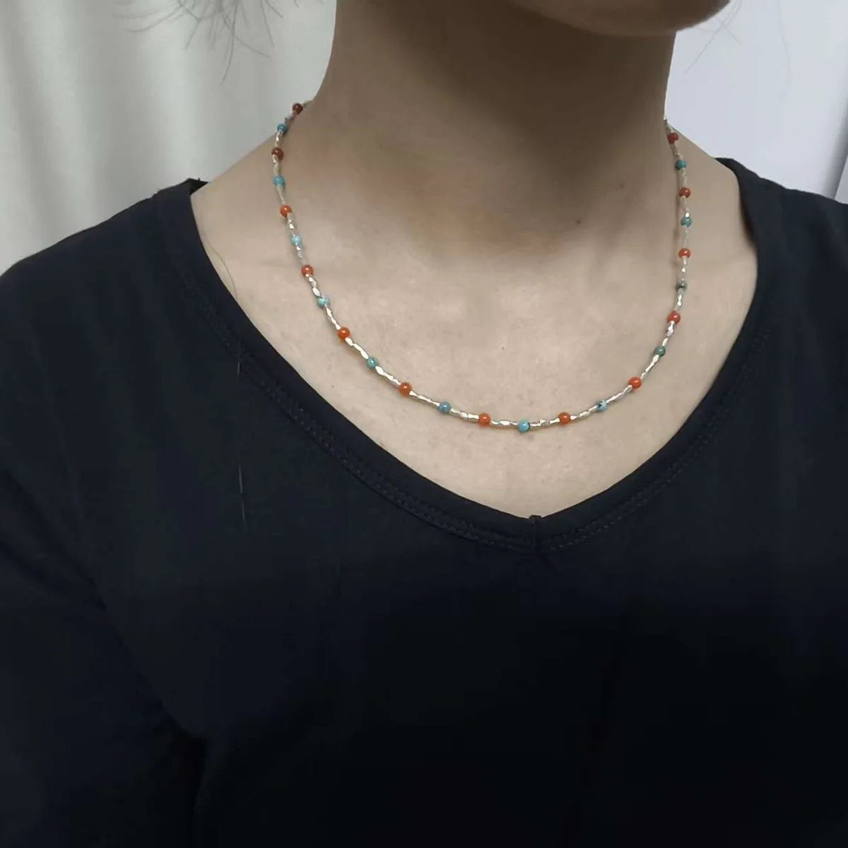Customer wearing SLV-006 necklace
