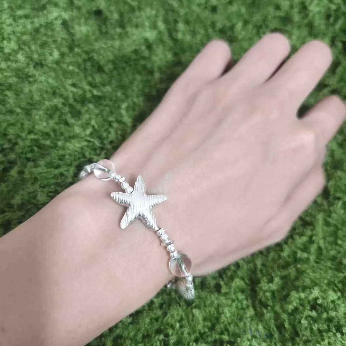 Customer wearing SLV-009 silver bracelet