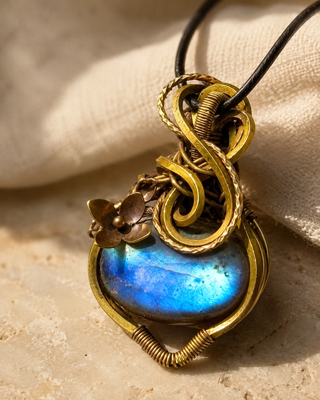 Blue-flash labradorite pendant wrapped by hand