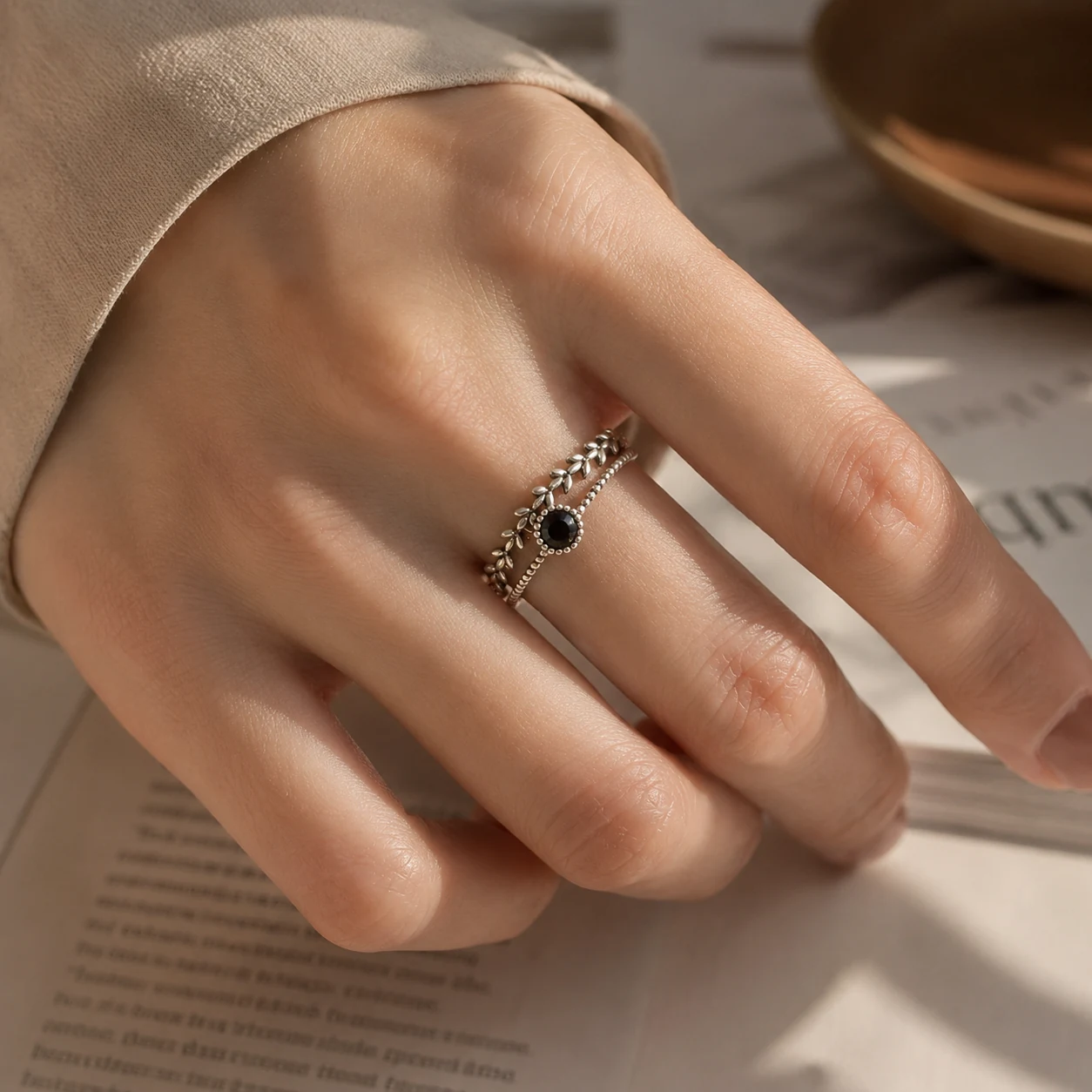 Delicate silver rings worn on the hand