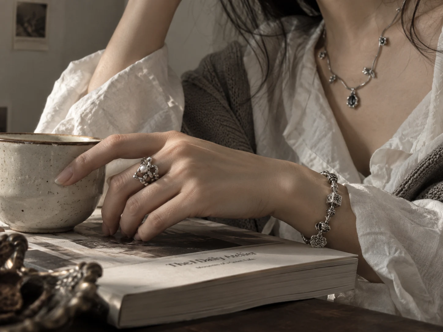 Silver jewelry worn during a quiet everyday ritual