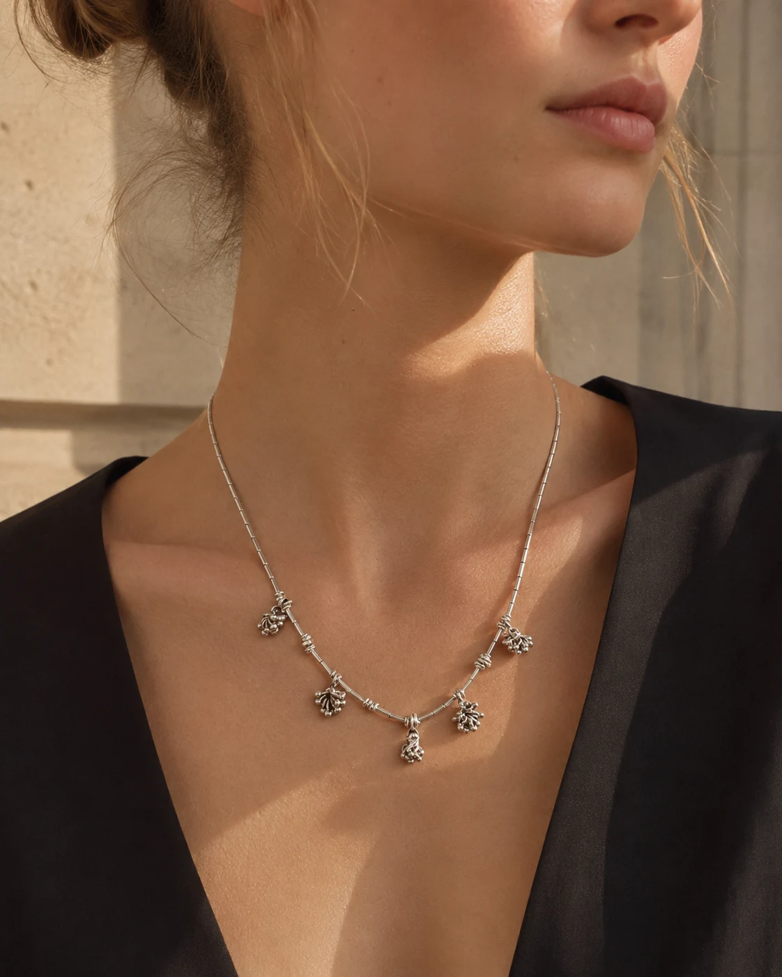 Handcrafted silver necklace worn over black