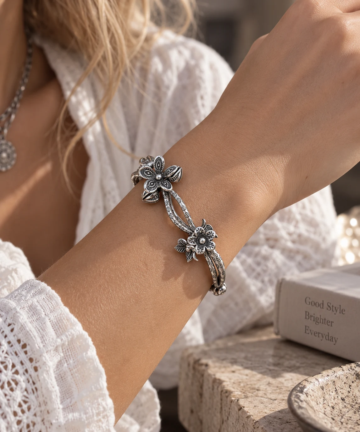 Ornate silver bracelet worn on the wrist