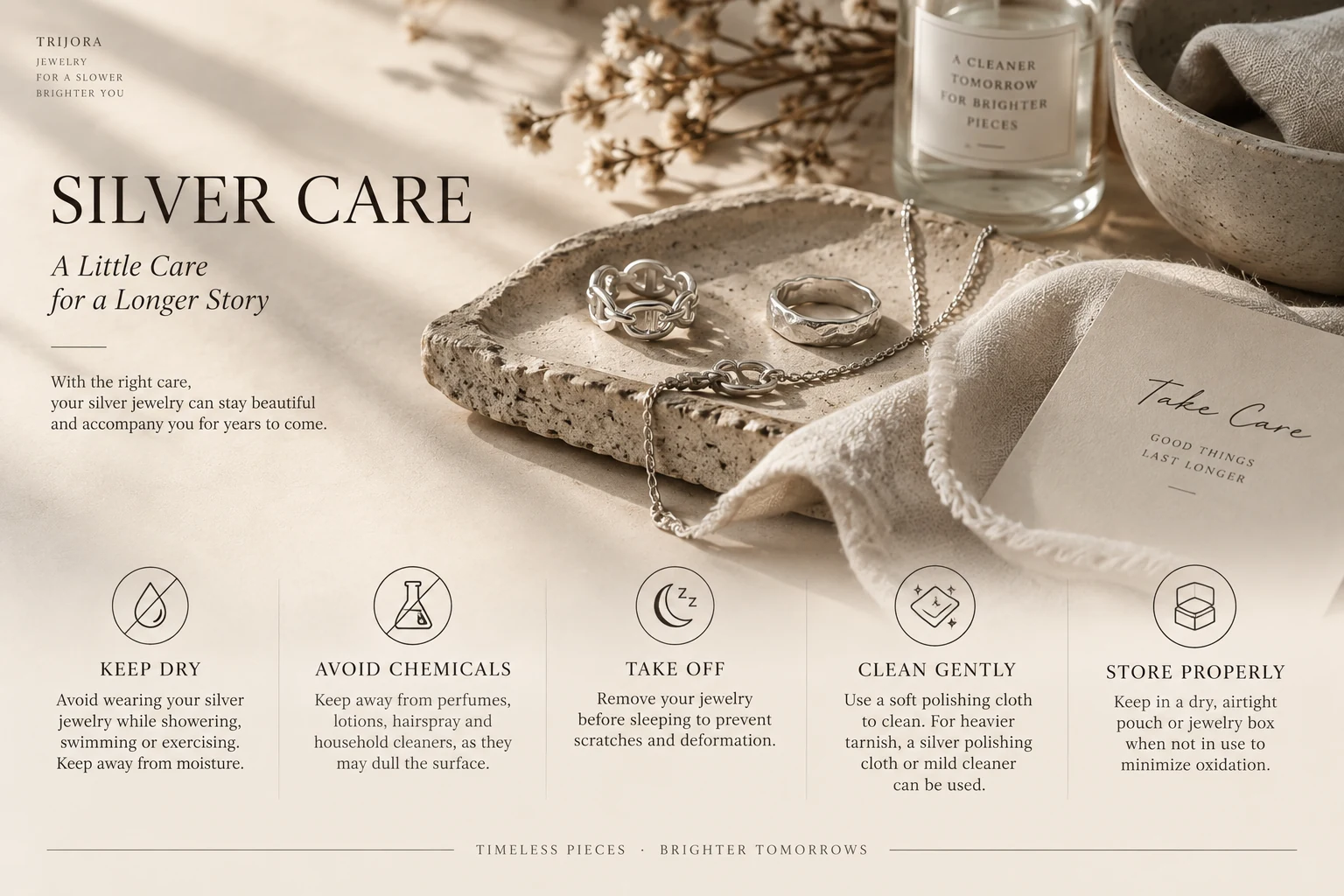 TRIJORA silver care guide and jewelry on travertine